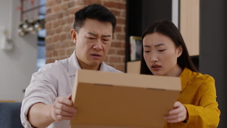 couple looking at a box