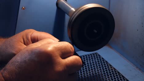 goldsmith polishing ring in workshop