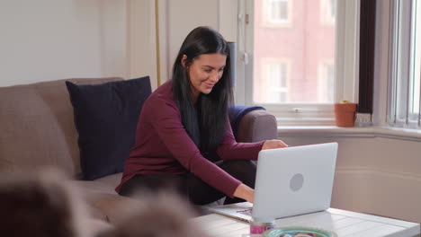 Slow-Motion-Shot-Of-Young-Attractive-Woman-Celebrating-After-She-Makes-Online-Purchase