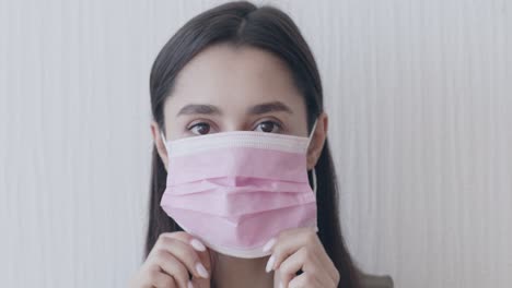 woman wearing pink face mask