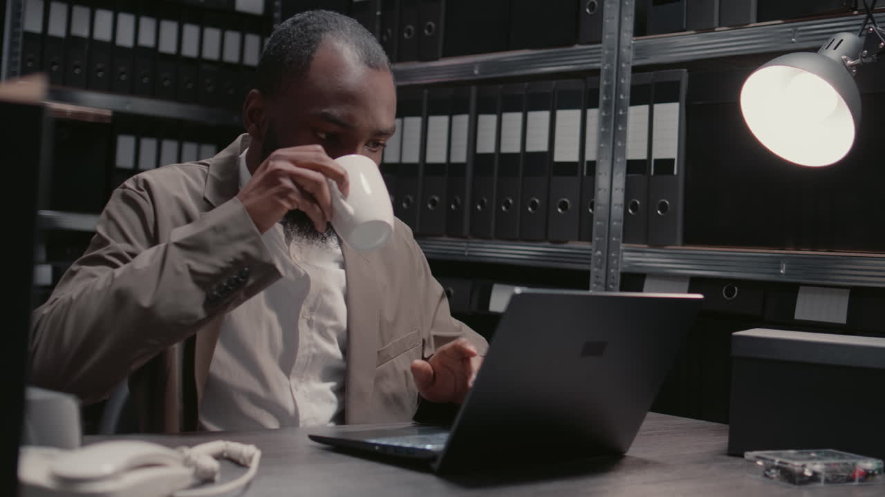 Man working on laptop in office