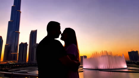 Couple in Dubai at Sunset by Burj Khalifa and Fountains