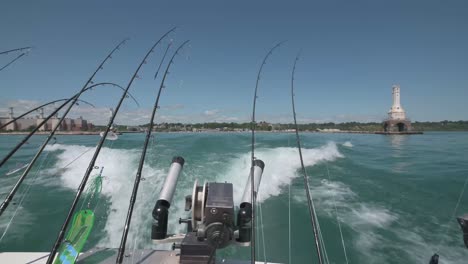 view looking out the back of a speeding fishing boat