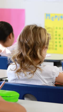 school kids studying in classroom