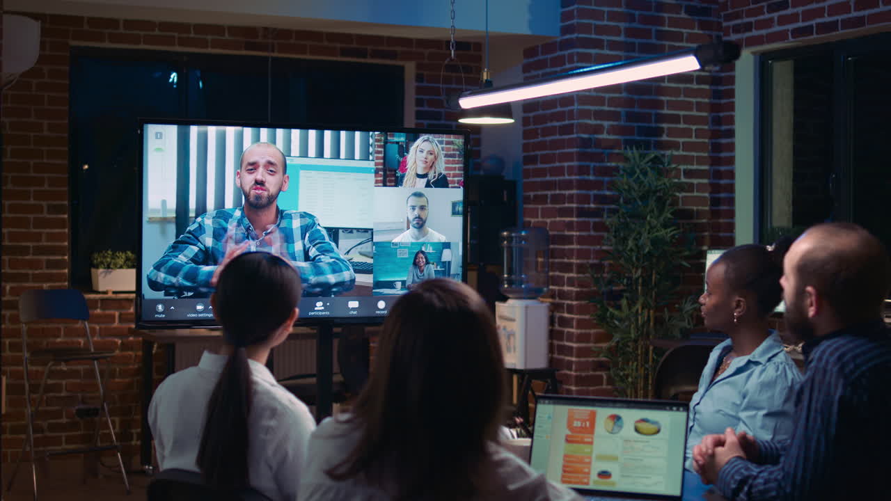 Diverse team discussing report statistics in business meeting videocall