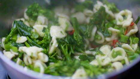 pasta cooking with broccoli and chilli