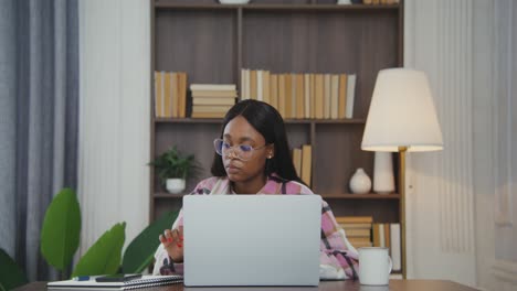 woman working on laptop at home