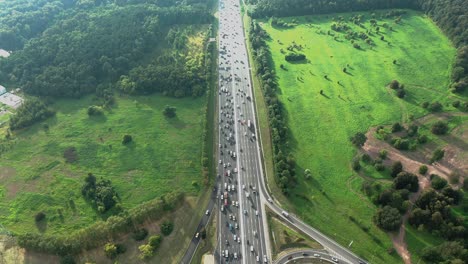 top down aerial view of highway with traffic jam at rush hour