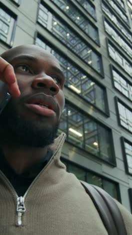 man on phone in city