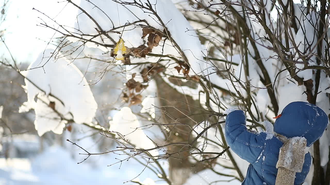 Boy with snow in winter. Little boy having fun with snow in winter day