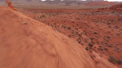 valley of fire high speed fpv aerial approaching car