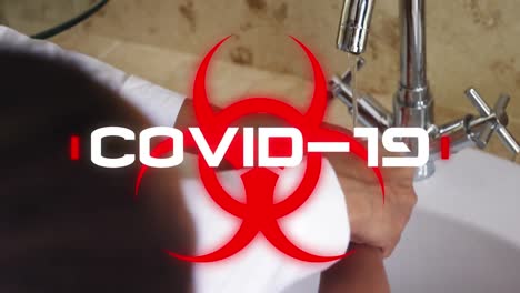 Gefahrenschild-Mit-Covid-19-Text-Gegen-Person,-Die-Sich-Die-Hände-Wäscht