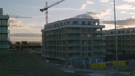 new luxury flats and offices construction site during sunset