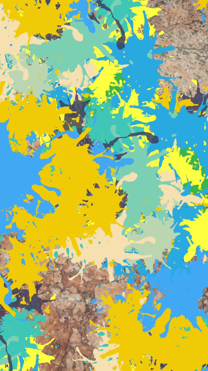 Animazione di diverse macchie colorate su un muro di mattoni