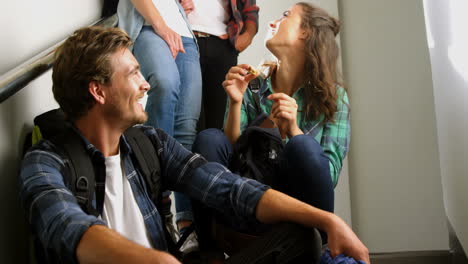 Friends-interacting-on-staircase