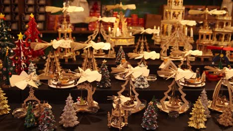 christmas shopping for wooden crafts at festive christmas market in strasbourg, france europe
