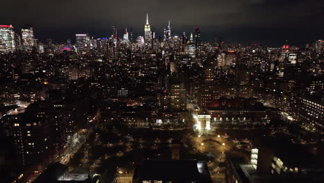 aerial view of washington square park and the empire state building. shot at night in new york city.