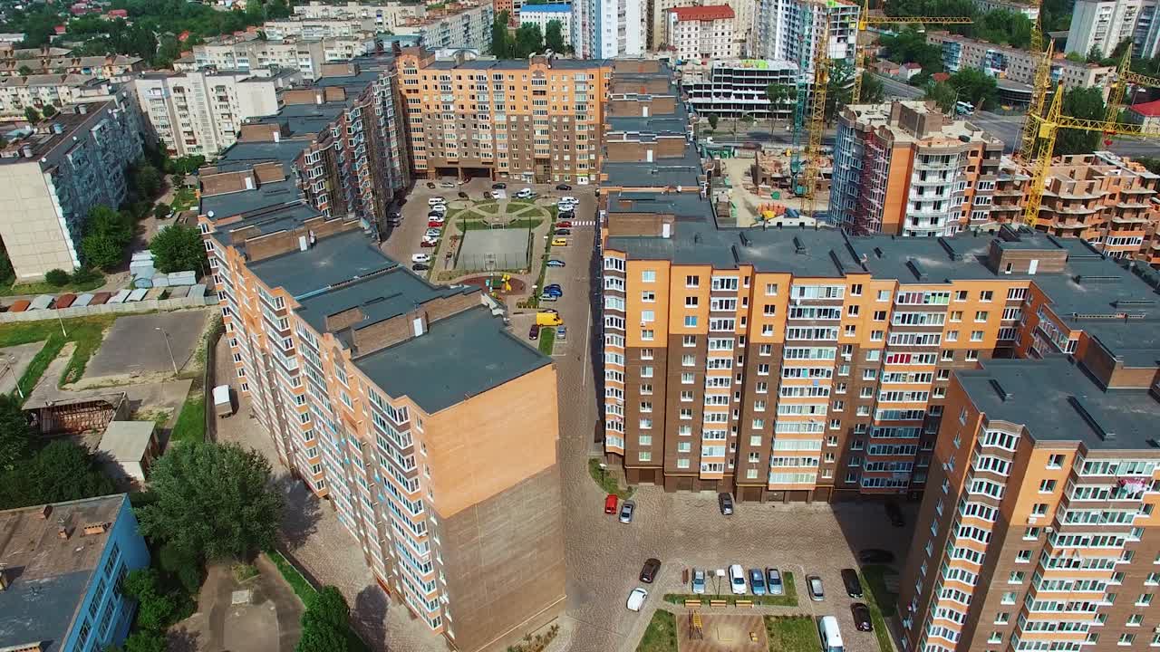 New apartments build in the city center. Modern urban district with architecture. Exterior of comfortable high-raised buildings.