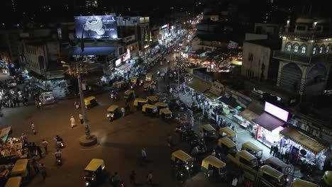 bustling night market in shivajinagar bangalore with rickshaws and crowds on busy streets