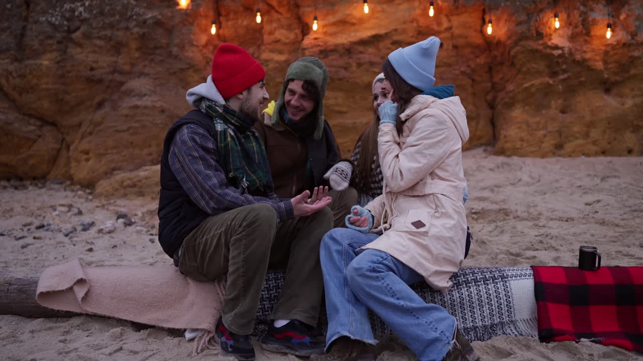 Friends Enjoying a Winter Beach Picnic