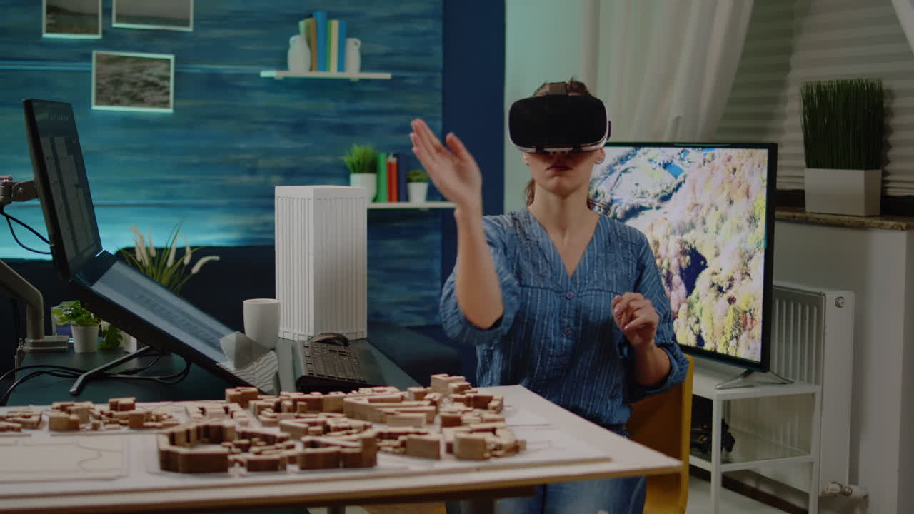 Architect using vr glasses for building design with blueprint