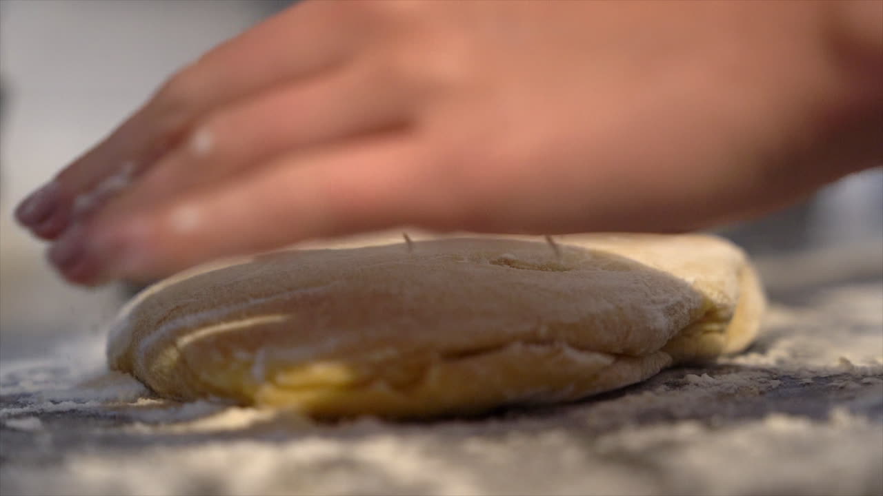 Preparing home made pasta dough with hands