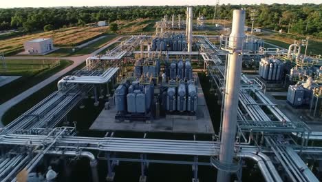 aerial view of industrial gas processing facility with extensive pipeline network and storage tanks, highlighting advanced infrastructure for energy production
