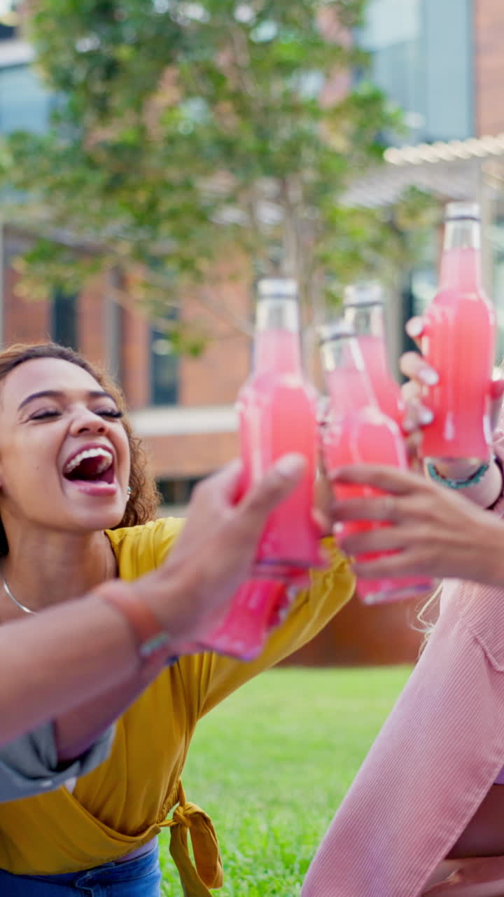 People enjoying drinks and pizza outdoors