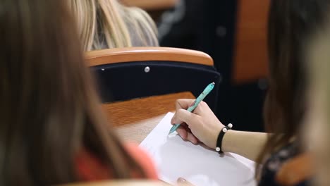 executive writing notes. close up of executive writing notes during business meeting