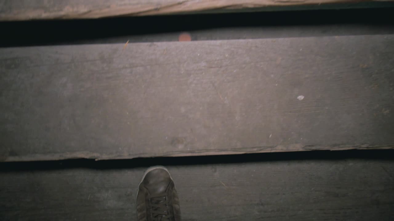 walking up an old wooden staircase in an abandonded lost place