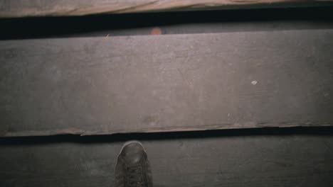 walking up an old wooden staircase in an abandonded lost place