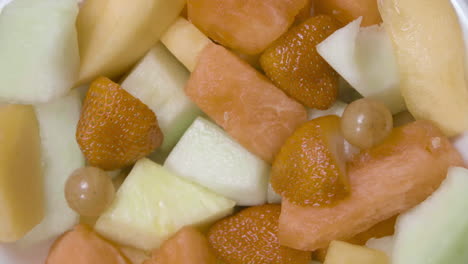 Fruit-salad-is-rotating-in-a-bowl