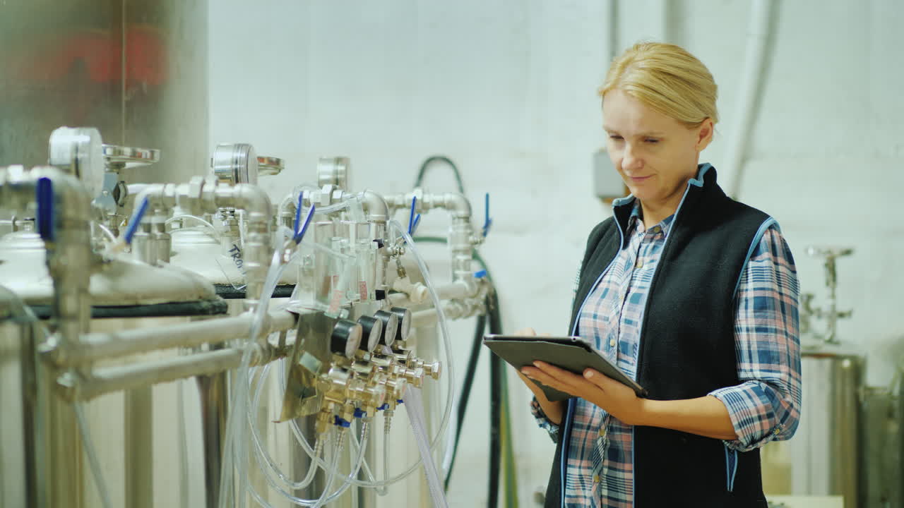 Quality Control In Production Hands Of An Engineer With A Tablet On The Background Of Instruments An