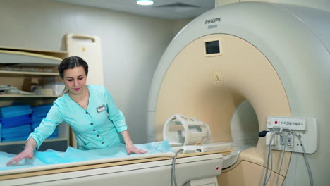 modern magnetic resonance device in clinic. laboratory worker prepares the mri machine before the scan procedure.