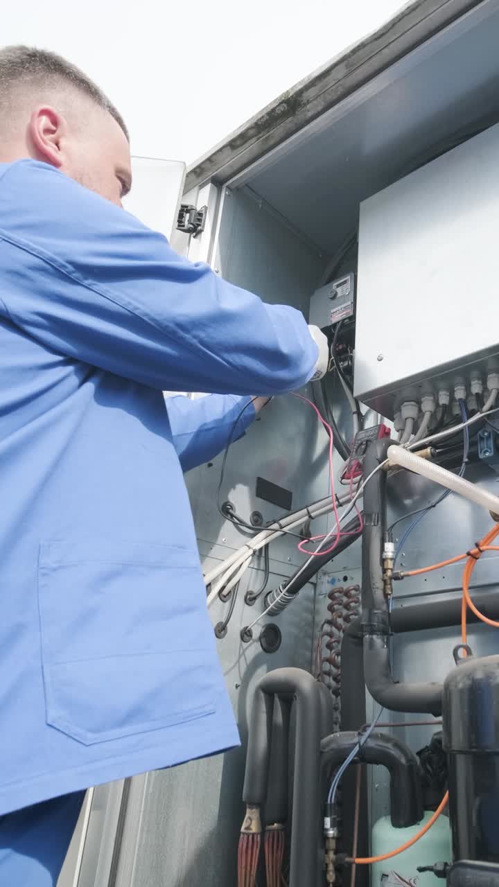 HVAC Technician Repairing Air Conditioning System
