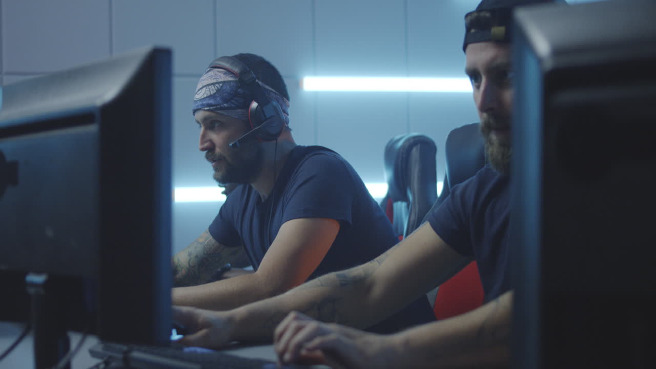 Male gamers focused on playing in an esports event