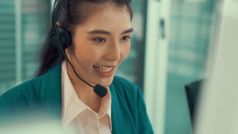 business people wearing headset working actively in office