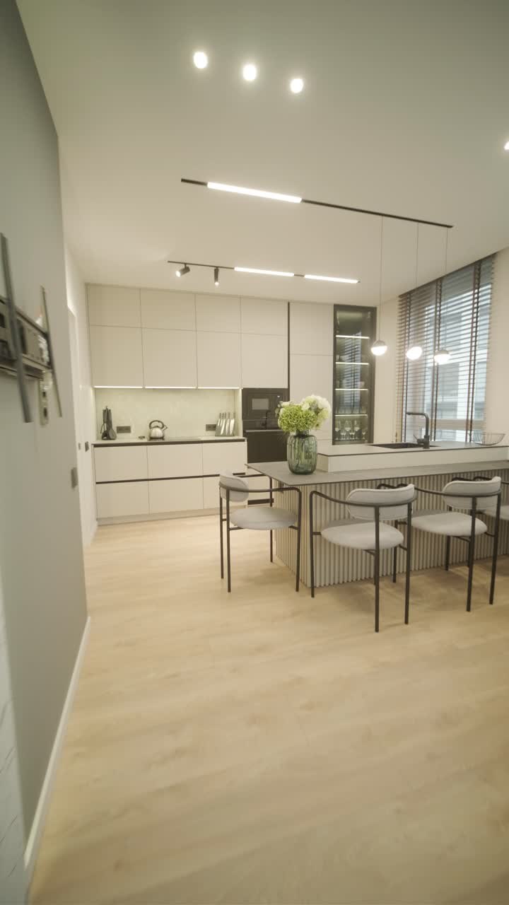 Modern minimalist apartment interior featuring simple decor, neutral tones, and clean lines. The design emphasizes functionality, creating a serene and organized living space.