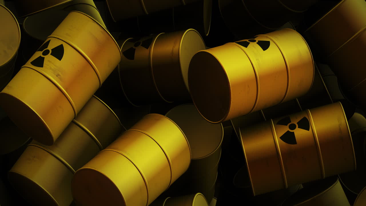 Animazione di più barili gialli con simboli nucleari neri.