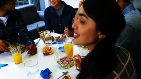 happy executives interacting while having breakfast