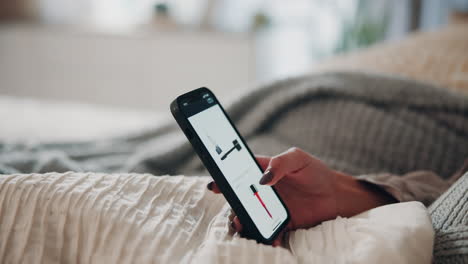 Woman Using Her Smartphone In Bed