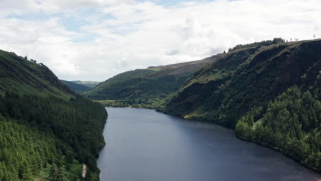 stunning aerial shot of glendalough upper lake in wicklow mountains national park in ireland