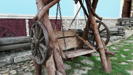 captivating serenity: embracing the beauty of an empty rural wooden swing in the wind at countryside