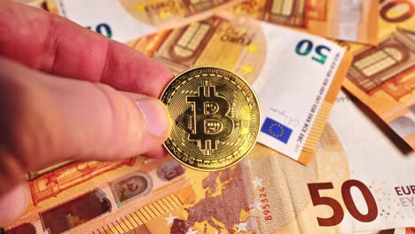 Digital bitcoin contrasts with fiat euro money spinning below in economic display