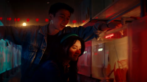 couple at a night market fish tank