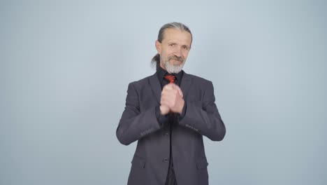 Businessman-making-a-trust-sign-at-the-camera.