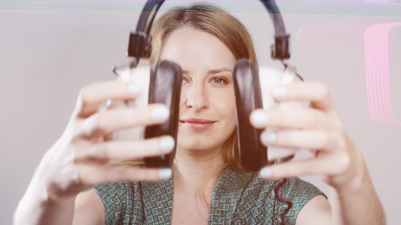 cool female dancer with changing retro headphones to listen to music