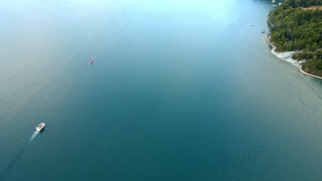 Aerial-view-truck-left-of-two-boats-on-Lake-Todos-Los-Santos-in-southern-Chile