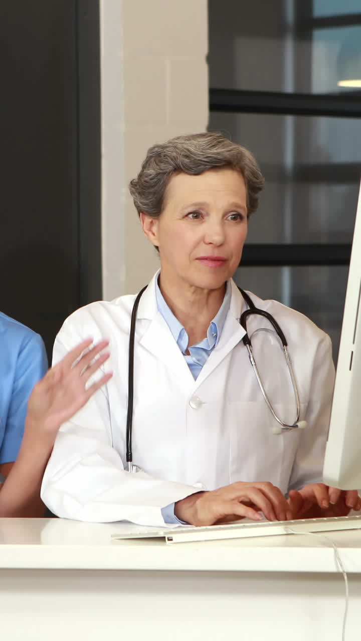 Female doctors using tablet and computer