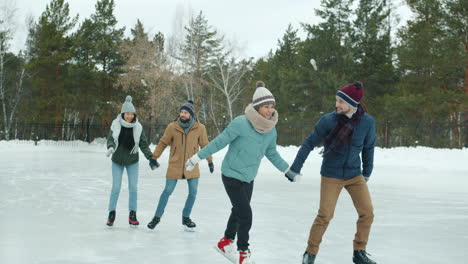 friends ice skating in winter